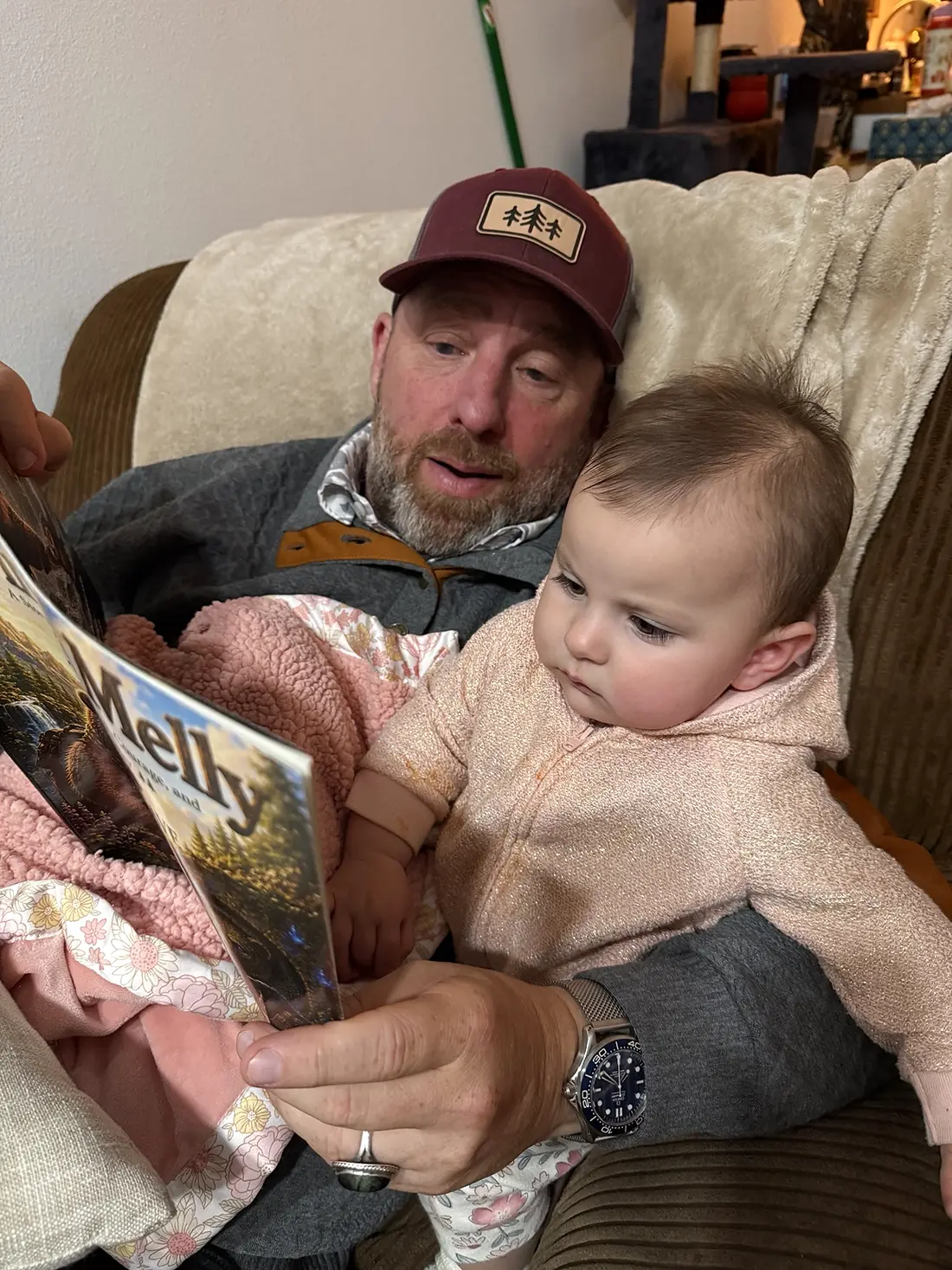Aaron Chavez reading Brin and Melly with his granddaughter Melody, the inspiration for Melly the owl